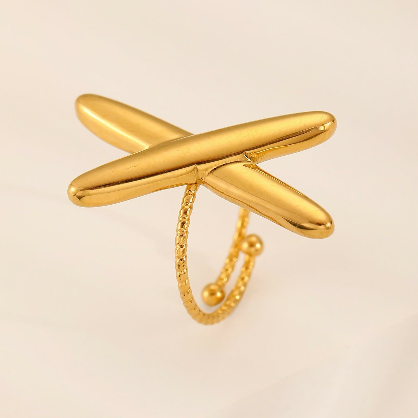 X shaped four point ring